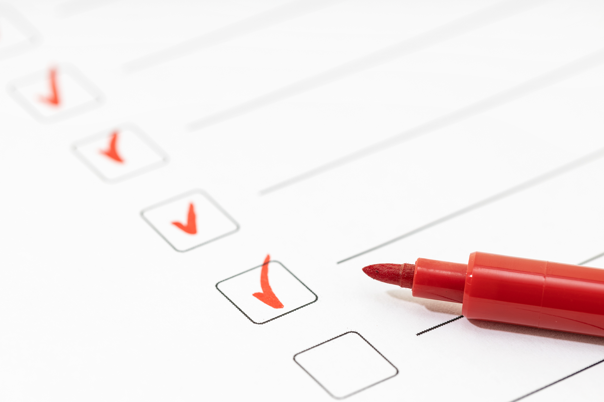 Checklist sheet and red marker. Check list completed task concept